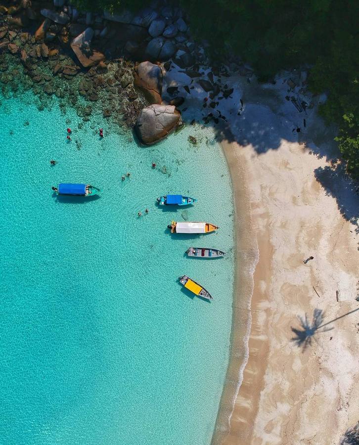 Turquoise lagoon with traditional longtail boats, Thailand